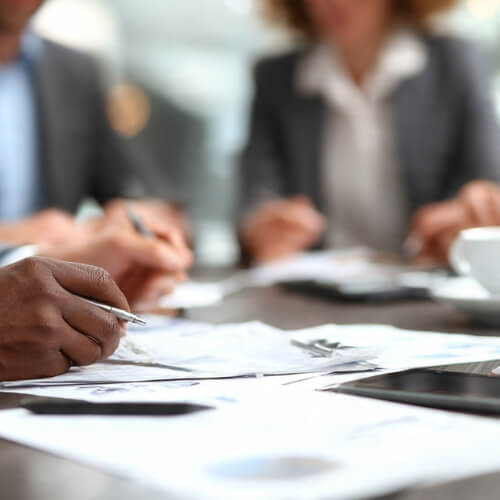 Business owner reviewing Corporate Taxes in Norcross, GA with a professional advisor.