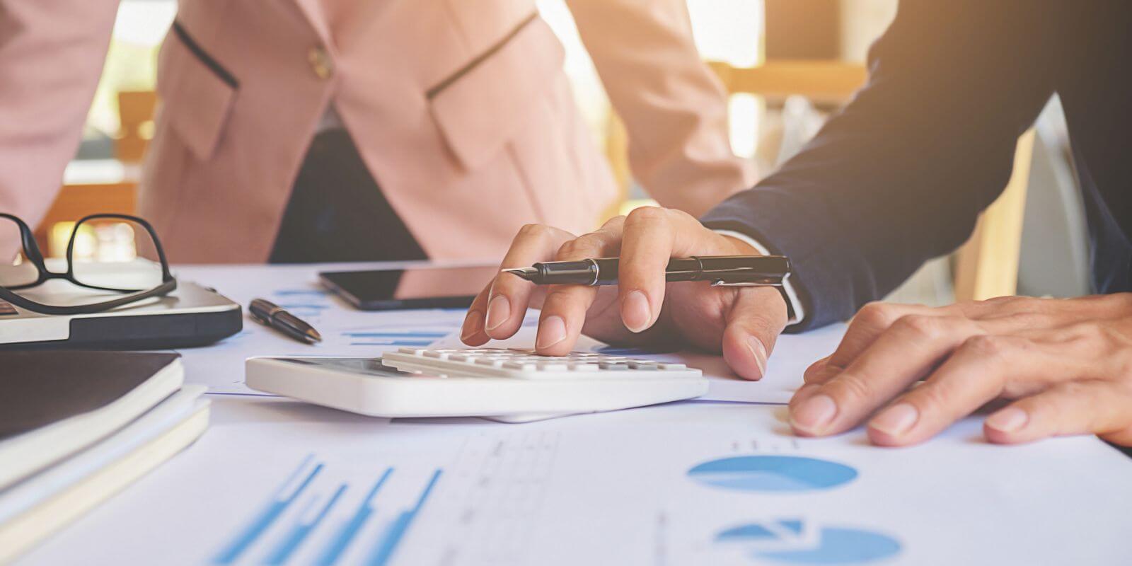 Individuals receiving itemized deductions are helped during a personal tax preparation appointment.