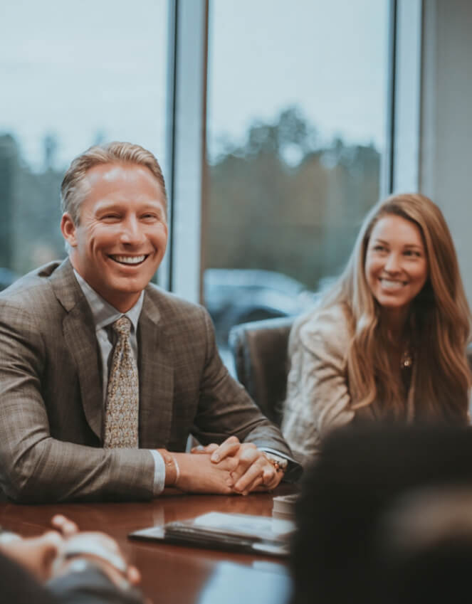 Corporate team celebrating successful tax planning and savings in Norcross, GA.