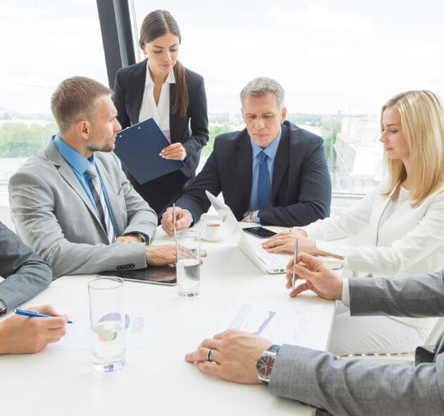 Tax specialist explaining partnership tax return options to society leaders in Norcross, GA